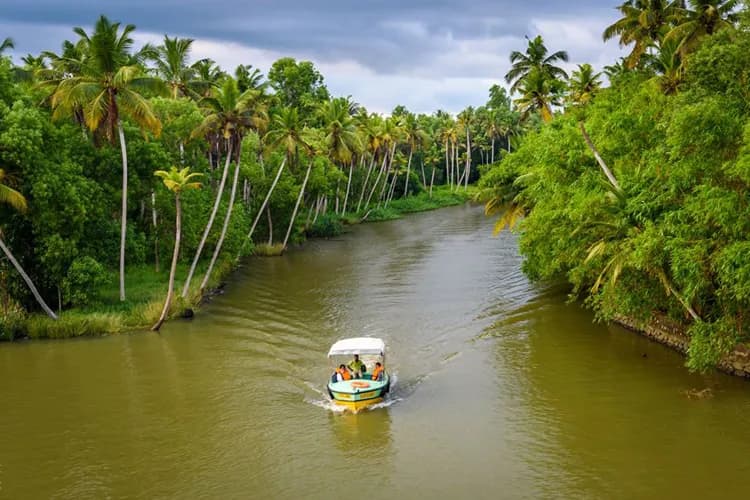 Premium luxury houseboat cruise in Poovar backwaters with modern amenities
