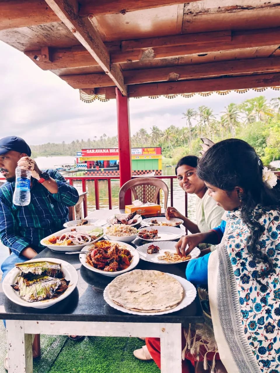 Traditional Kerala lunch served at Poovar Floating Restaurant during backwater cruise